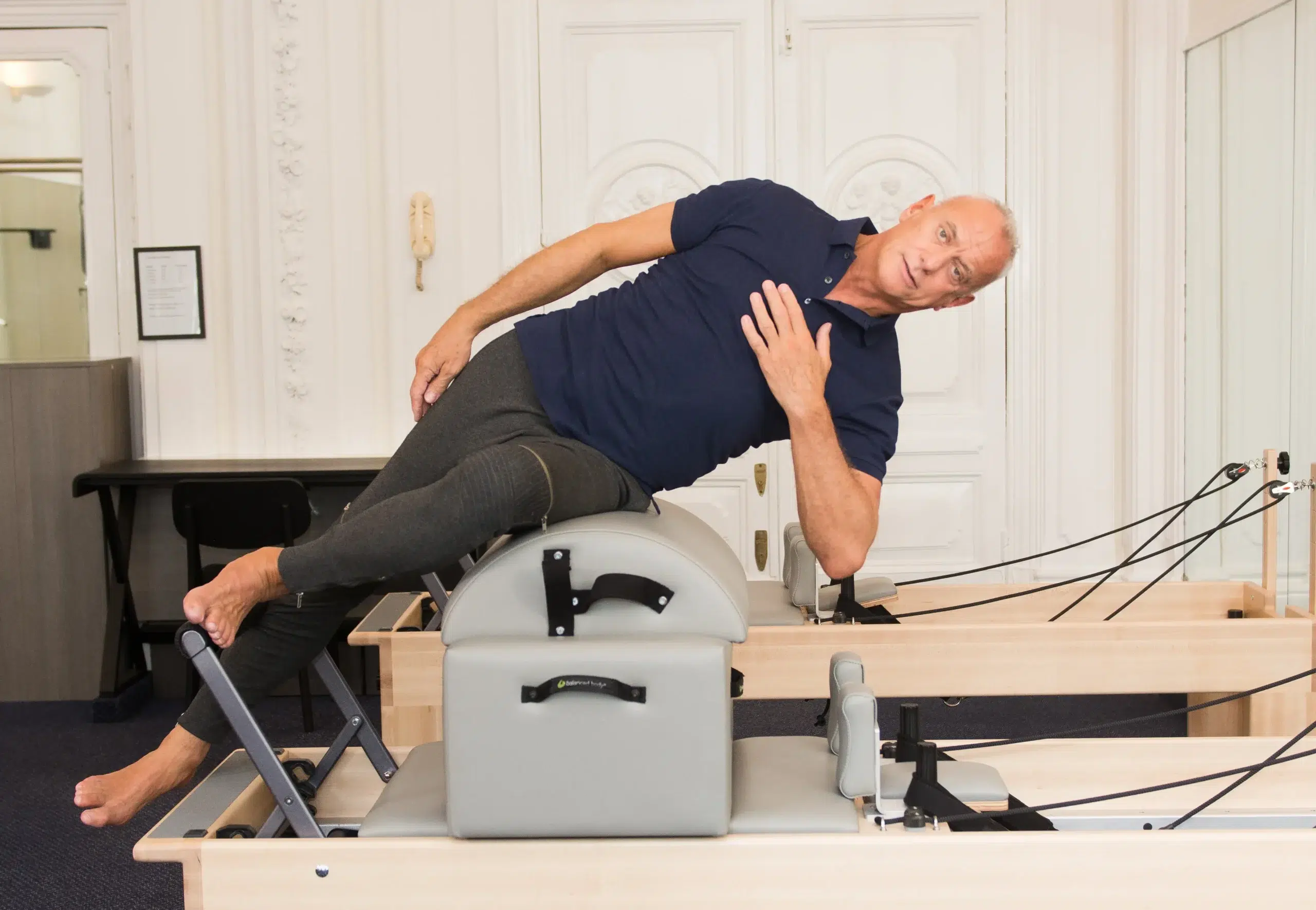 One-to-one clinical Pilates session focused on posture and movement control